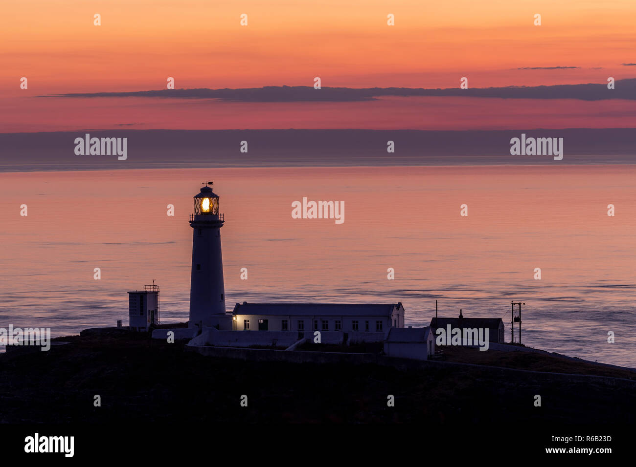 South Stack lighthouse at dusk on the coast of Anglesey, North Wales Stock Photo