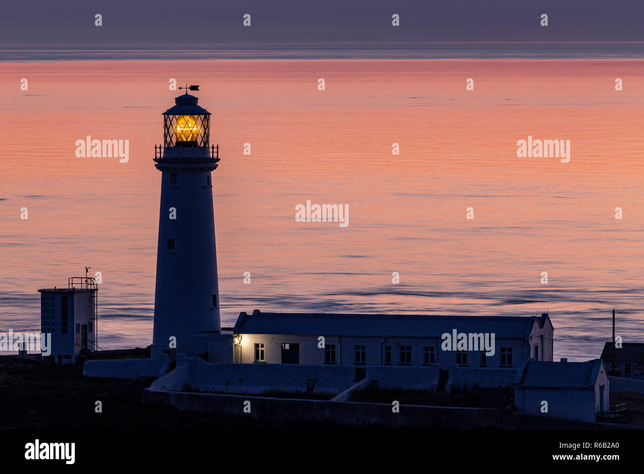 South Stack lighthouse at dusk on the coast of Anglesey, North Wales Stock Photo