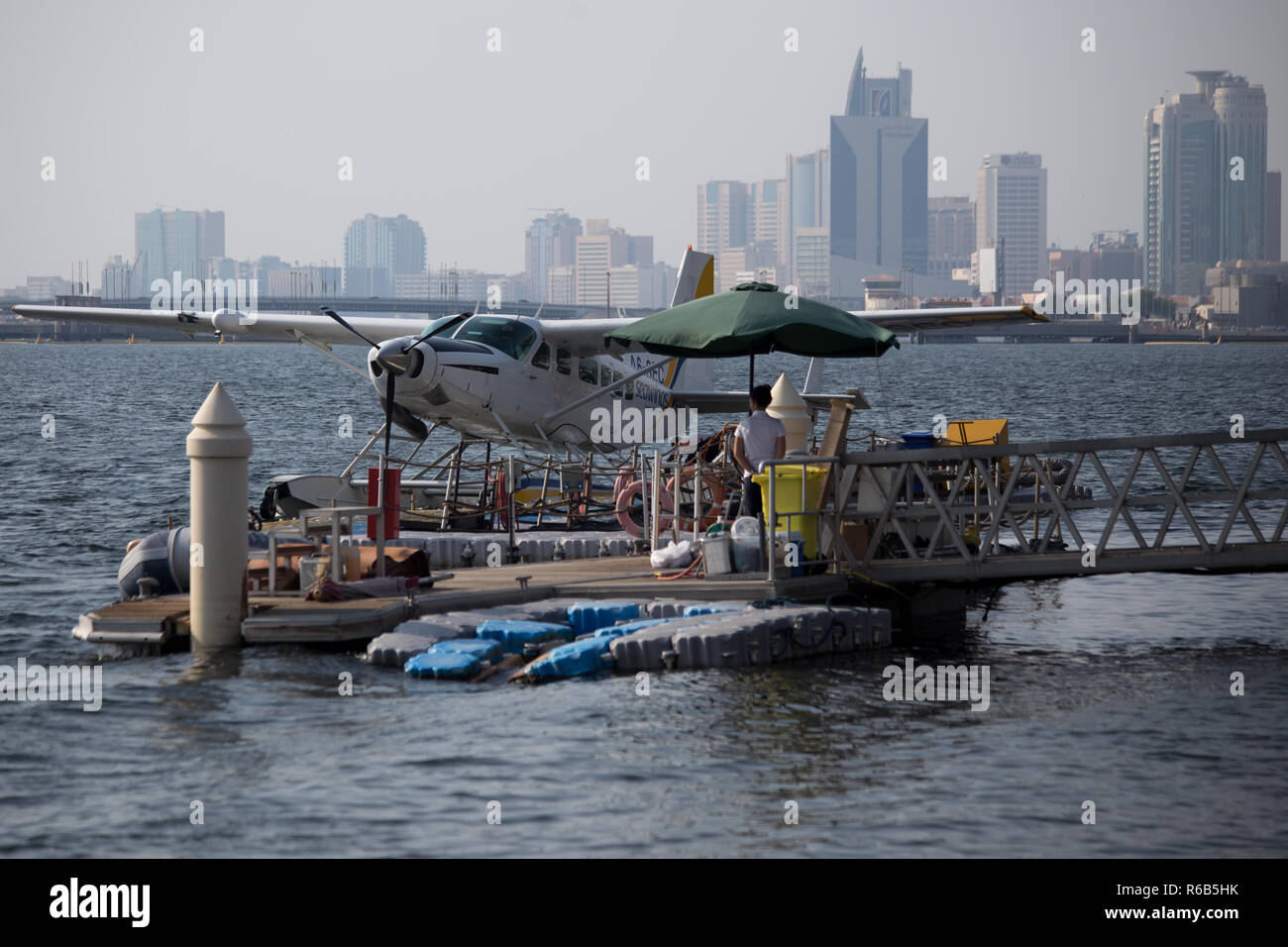 A female Asian model prepares for a Seaplane Flight in Dubai, United Arab Emirates. Stock Photo