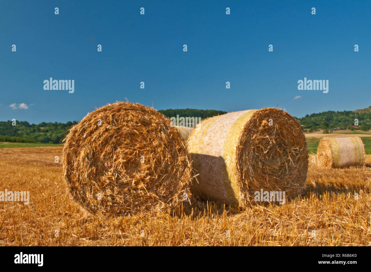 Bale Of Straw With A Blue Sky Stock Photo - Alamy
