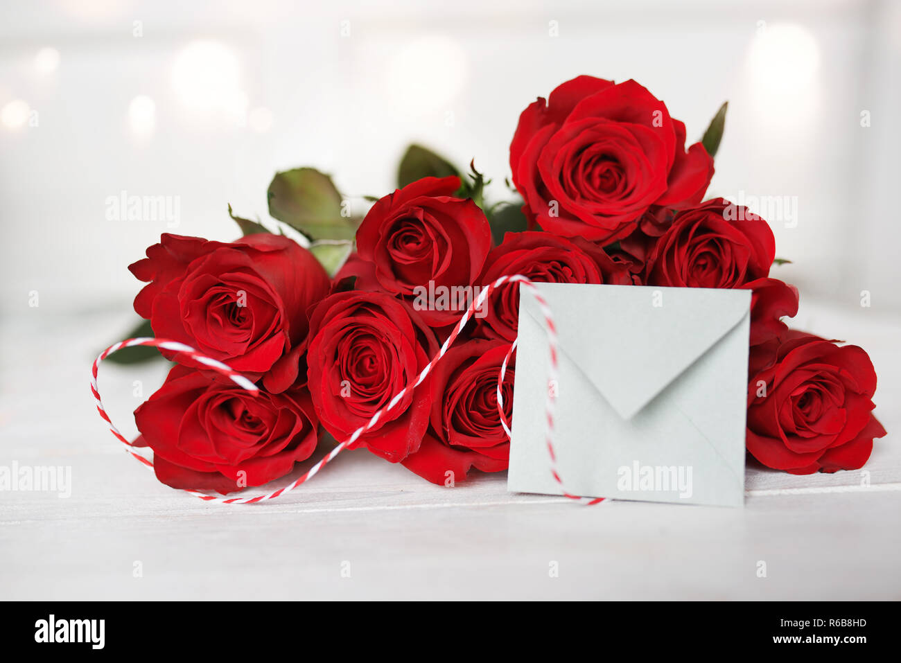 red roses with love letter Stock Photo - Alamy