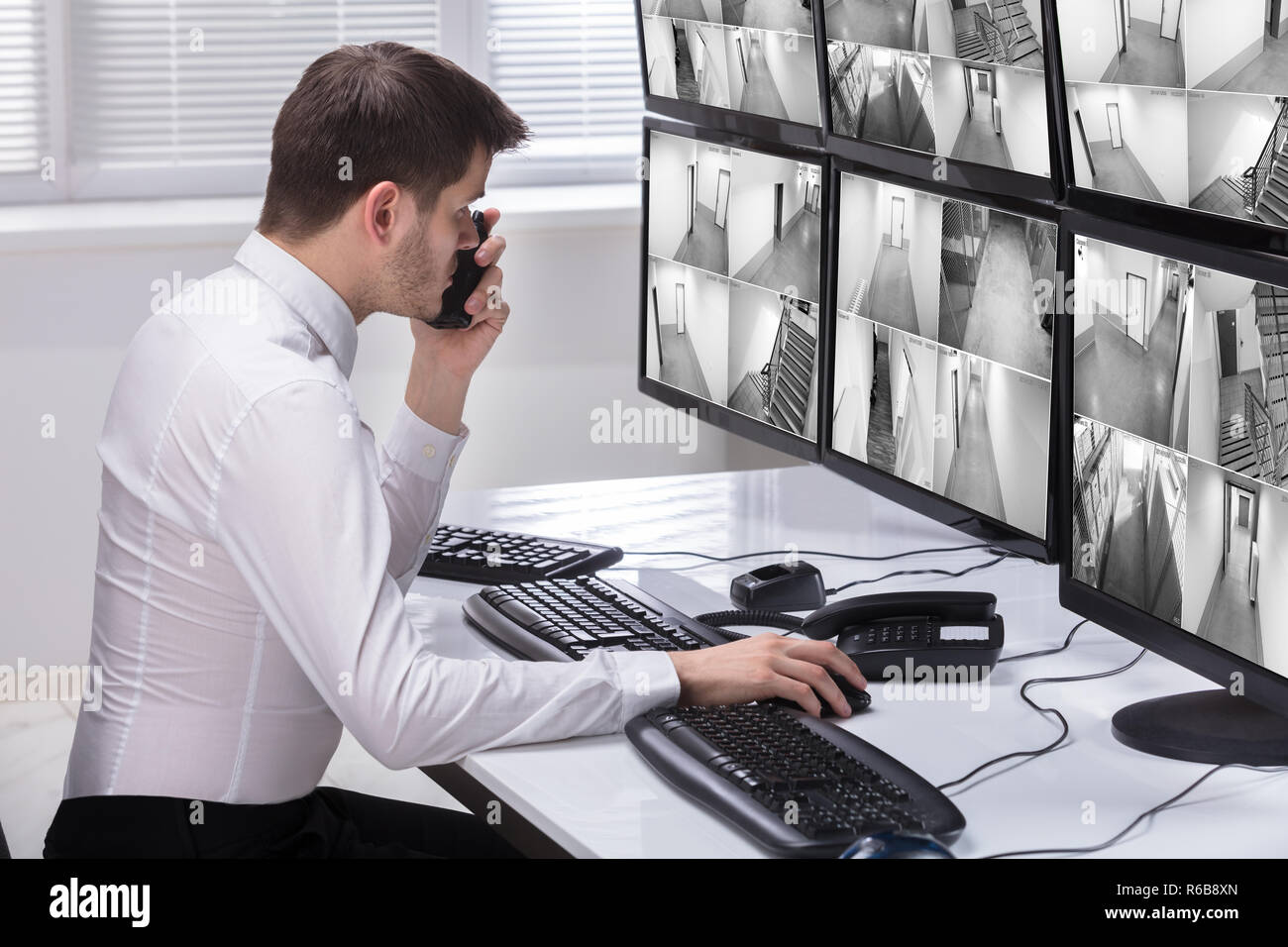 Security Guard Monitoring CCTV Footage Stock Photo Alamy