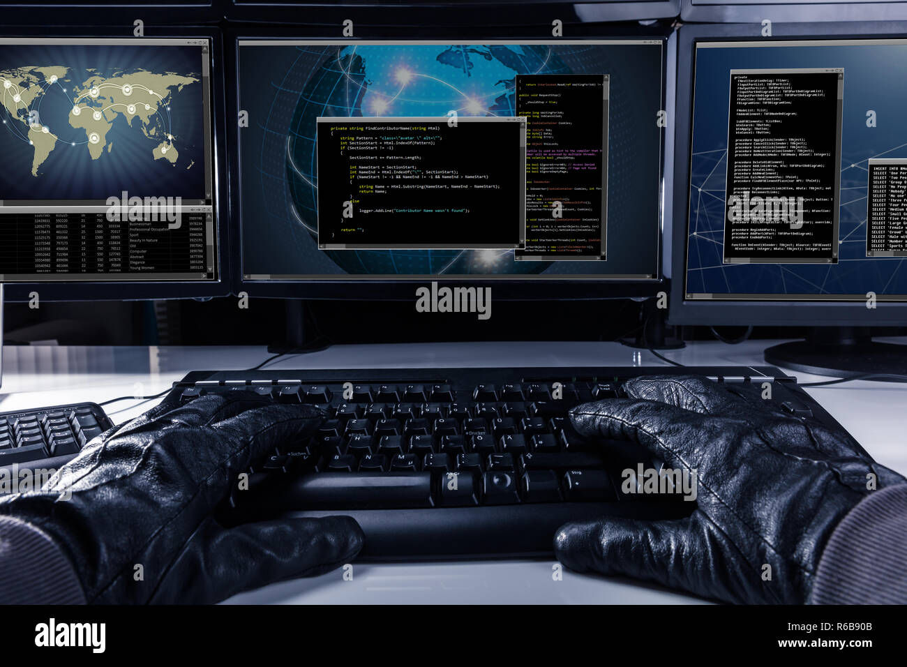 Hacker typing code on computer keyboard stock photo alamy