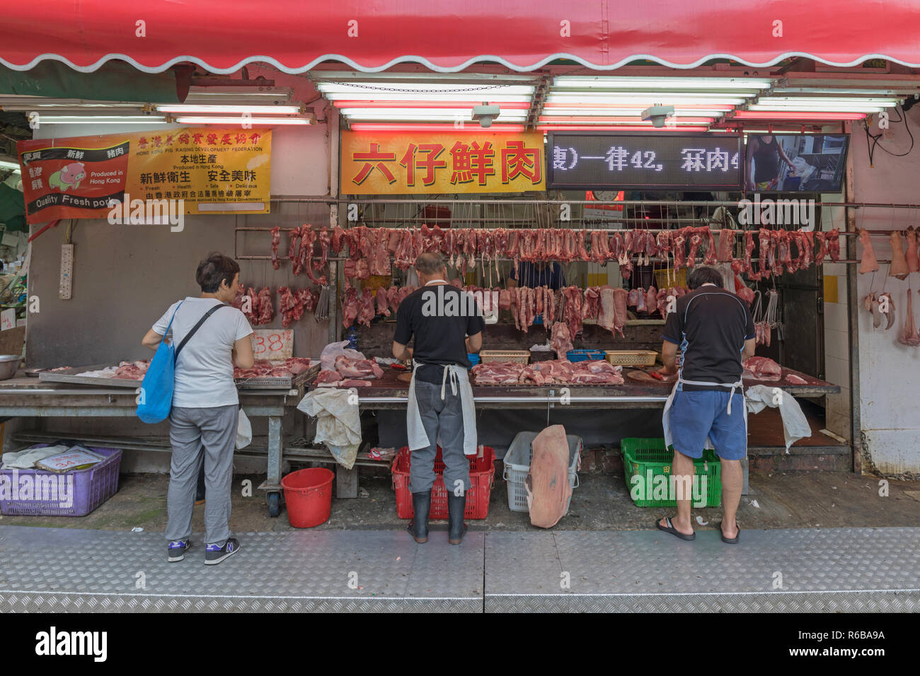 KOWLOON, HONG KONG - APRIL 21, 2017:  Butcher Shop at Mong Kok in Kowloon, Hong Kong. Stock Photo