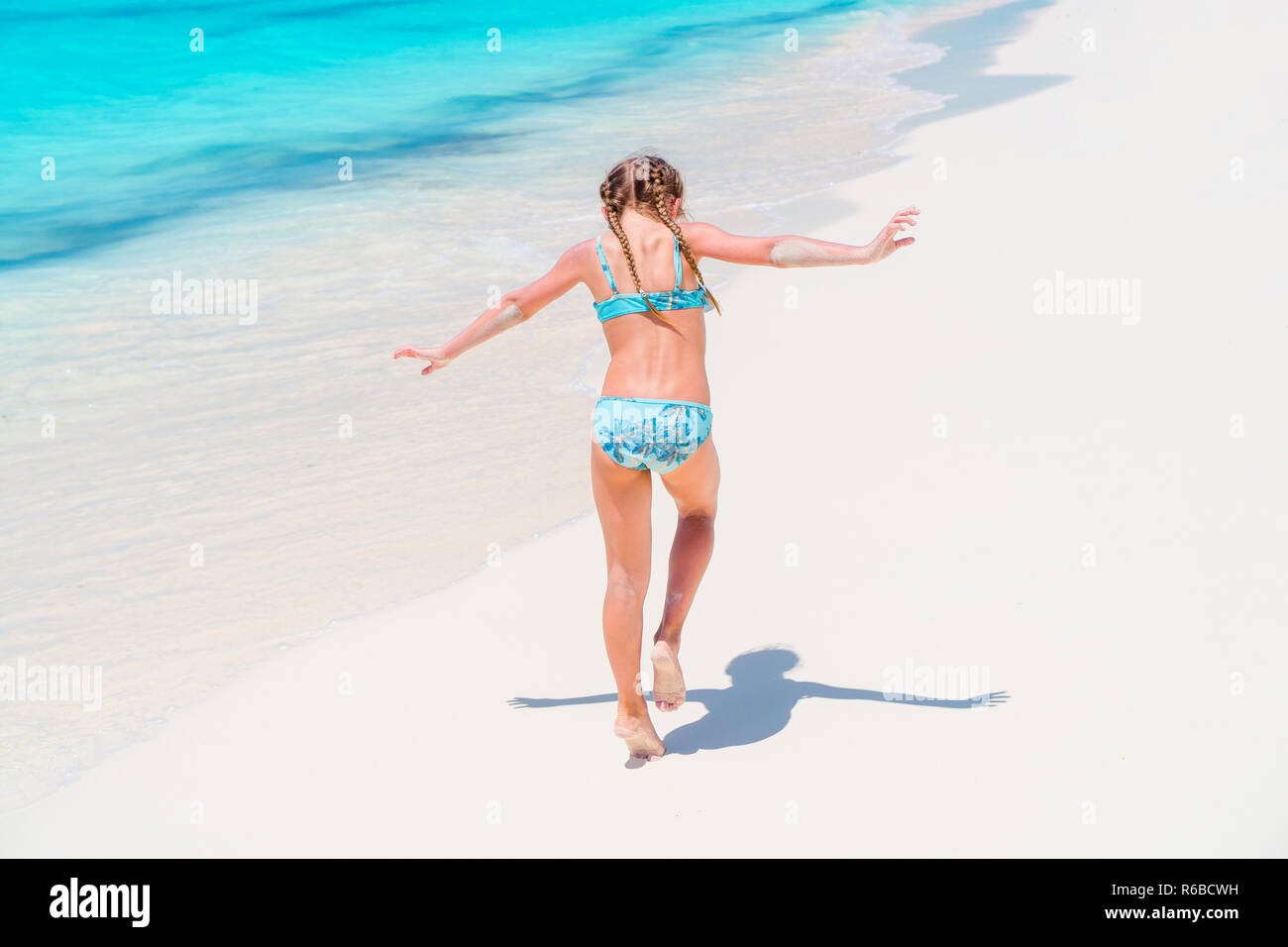 little girl in bikini on beach