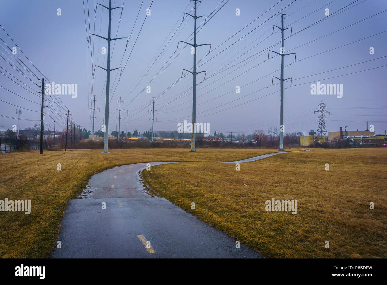 Electricity pylons along a road hi-res stock photography and images - Alamy
