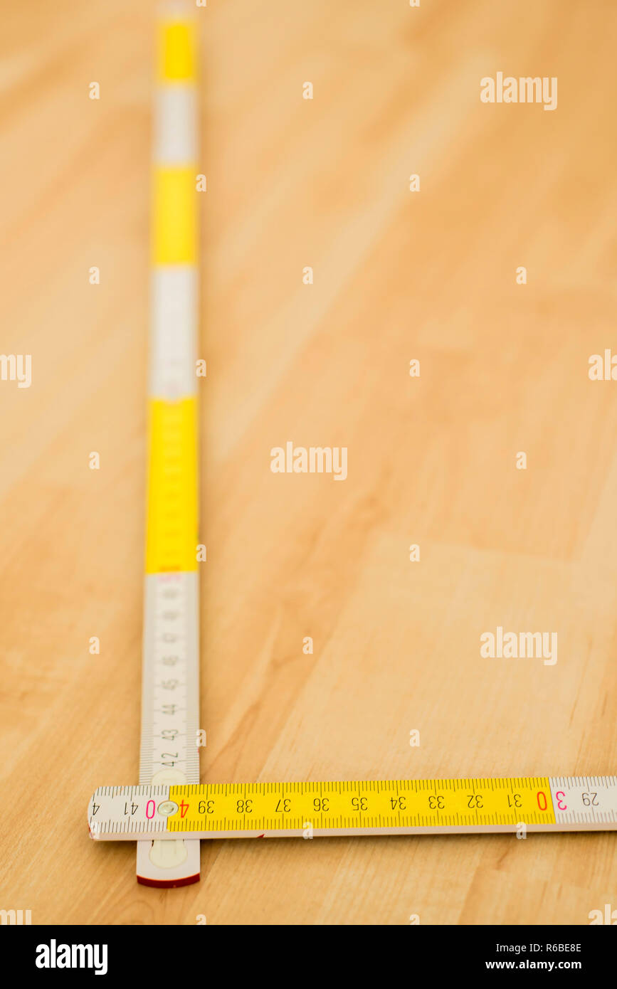 Laminate Floor With Folding Rule Stock Photo Alamy