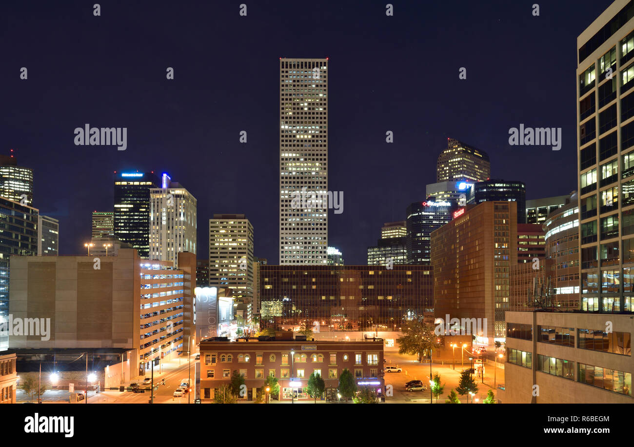 At night with all the lights and tall buildings of central Denver business and financial centre, Colorado, USA Stock Photo