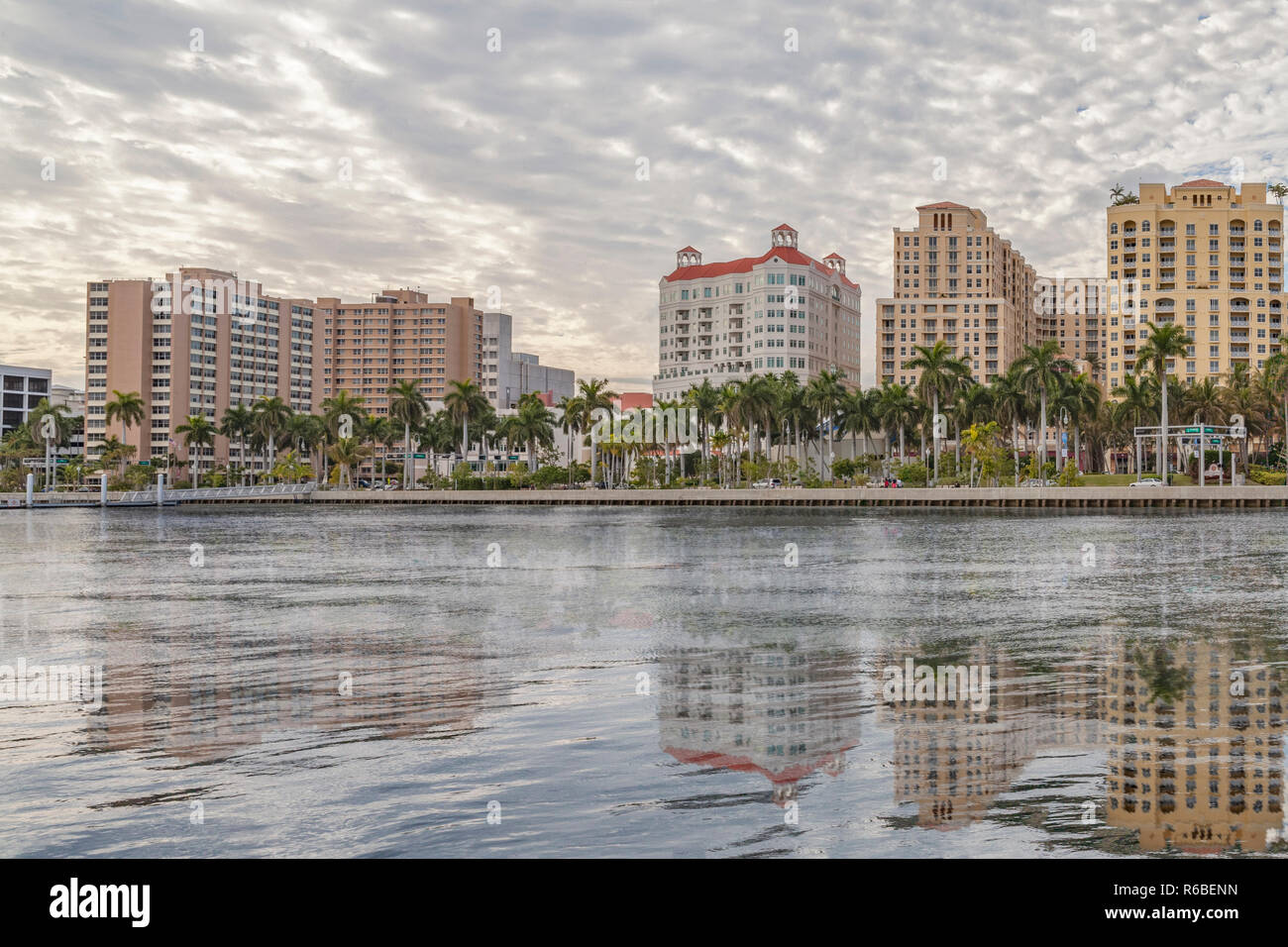 Waterfront reflections of West Palm Beach, Florida. A late afternoon on the water's edge are reflections of pristine architecture of the city. Stock Photo
