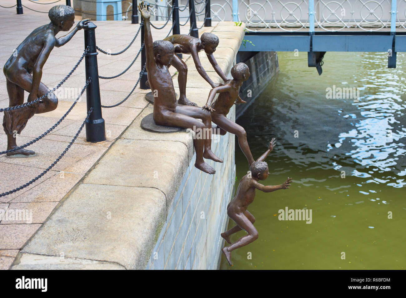 Children jumping river statue, Singapore Stock Photo