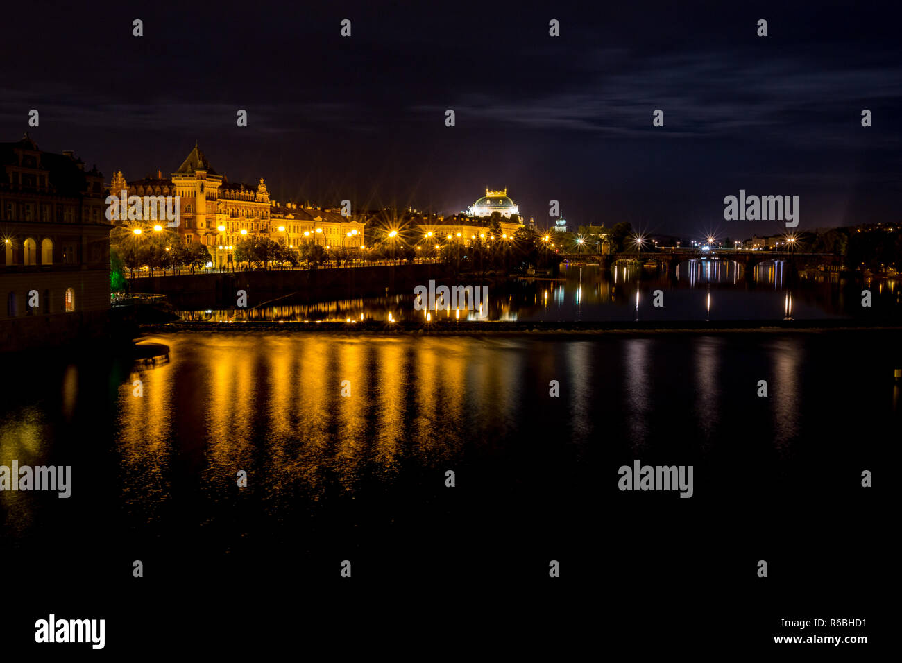 Long exposure night photo, beautiful cityscape as seen from Charles Bridge, Prague towards the old center of of the Czech Republic capital, summer nig Stock Photo