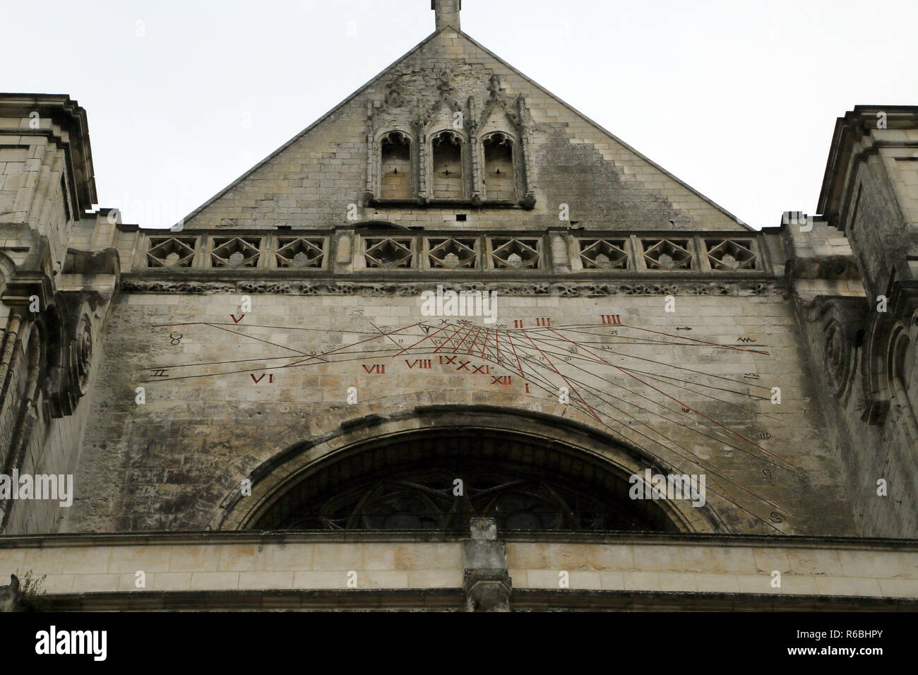 Sun dial on exterior wall of cathedrale notre dame, Enclave Notre Dame, Saint Omer, Pas de Calais, Hauts de France, France Stock Photo