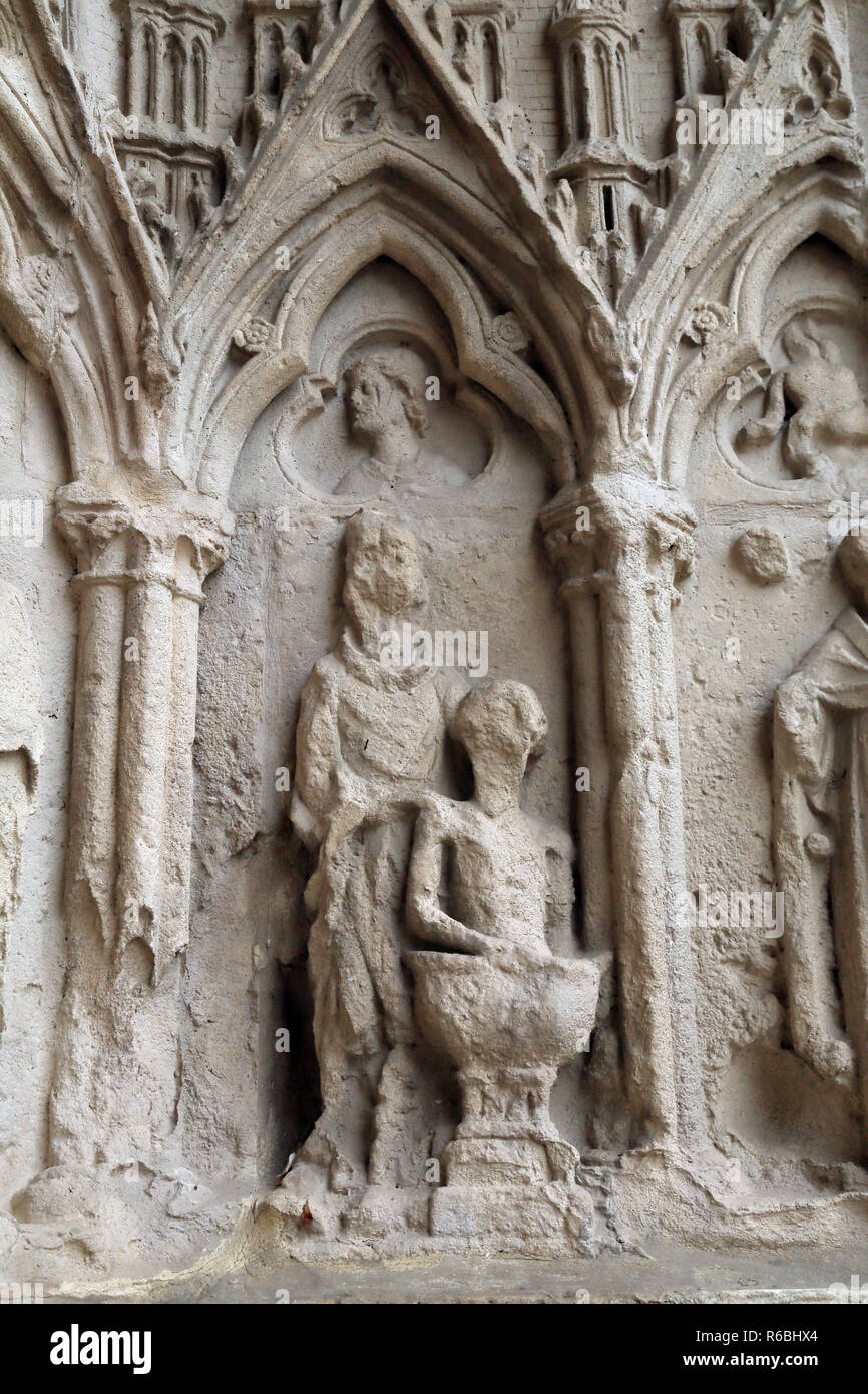 Stone carvings at the 13th century entrance to cathedrale notre dame, Enclave Notre Dame, Saint Omer, Pas de Calais, Hauts de France, France Stock Photo