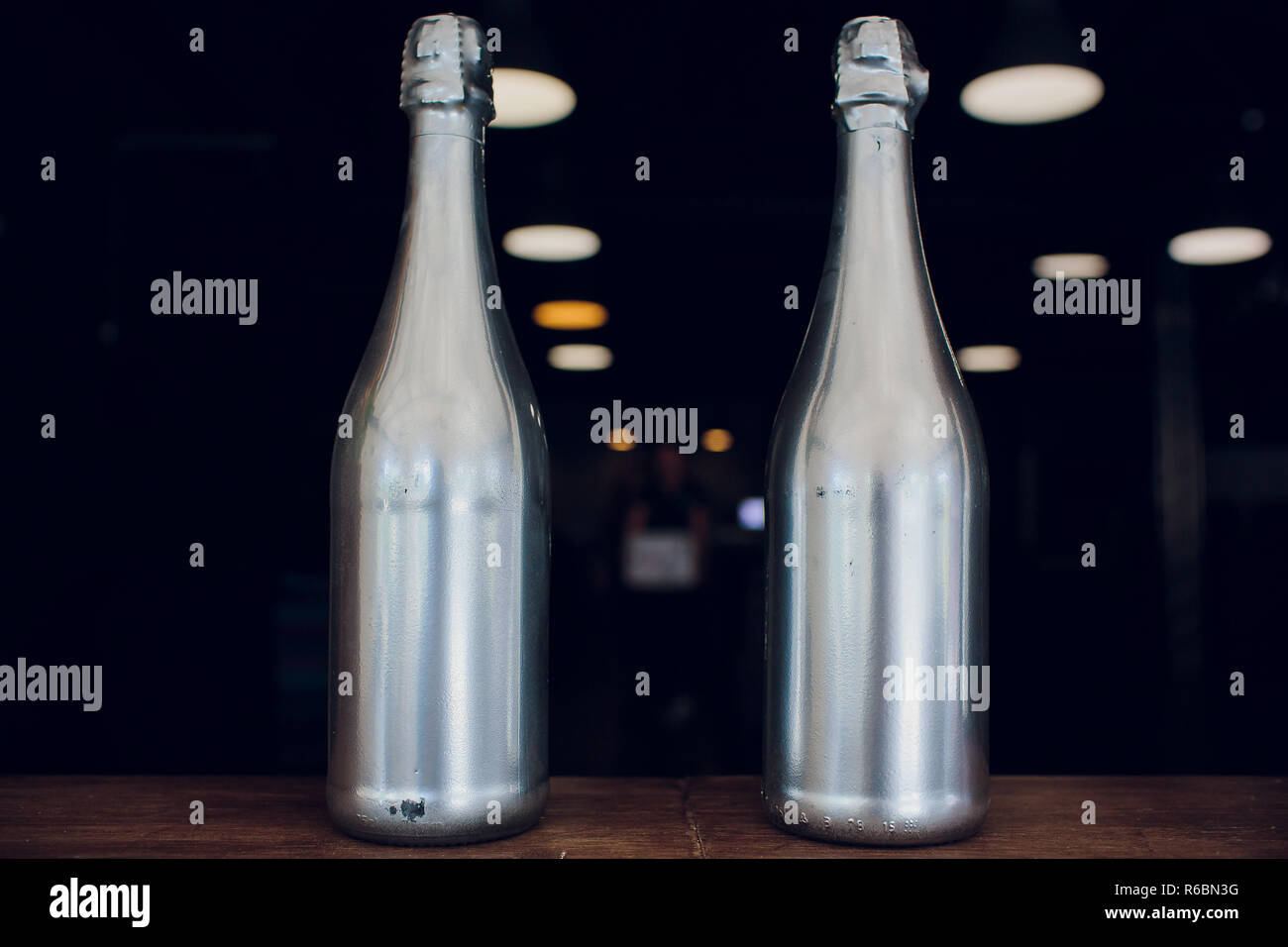 Wine champagne bottles silver on wooden shelf liquor store Stock Photo