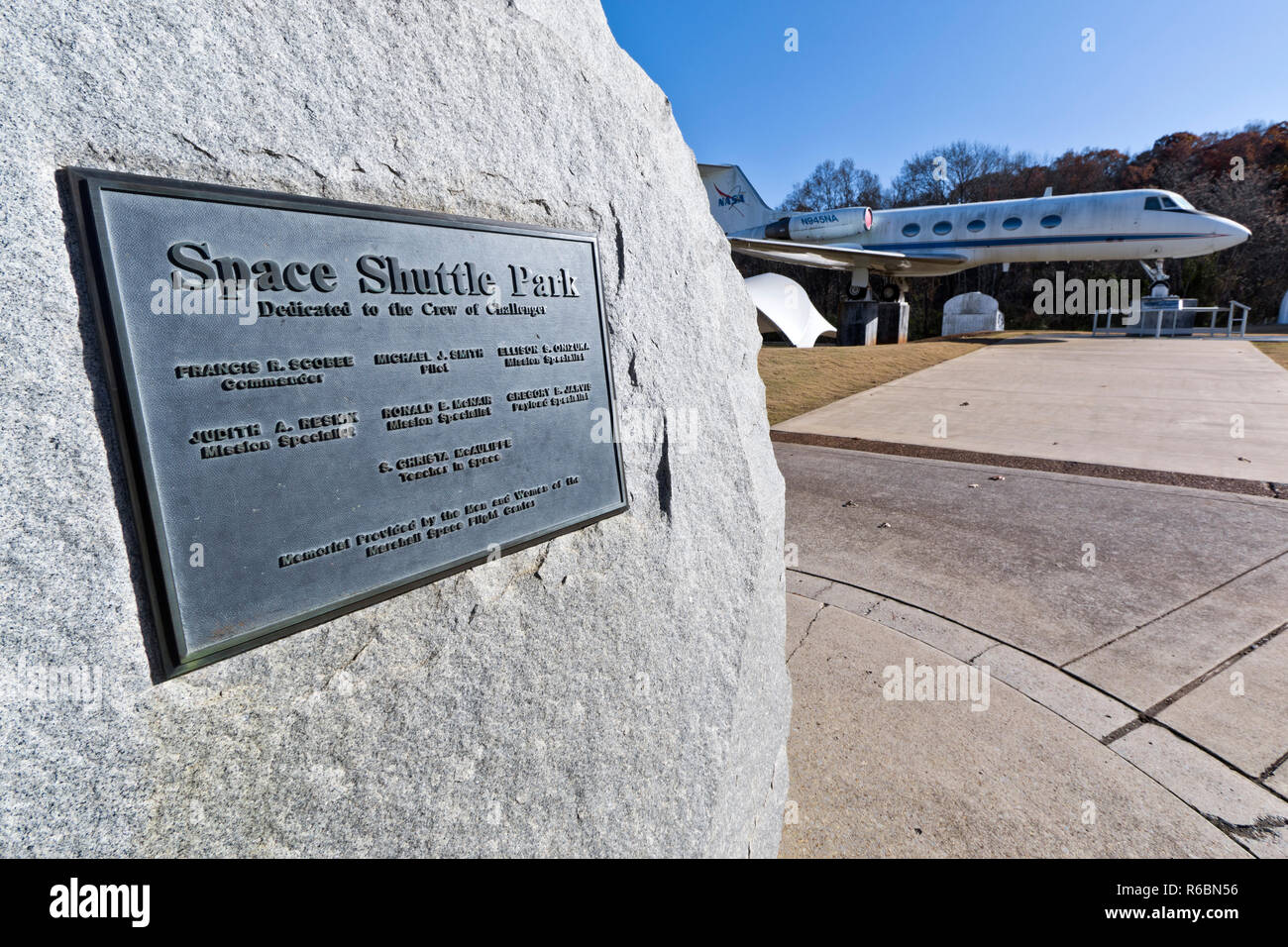 Challenger Memorial Stone at the US Rocket and Space Center in Huntsville, AL, with the Shuttle Training Aircraft on exhibition in the background Stock Photo