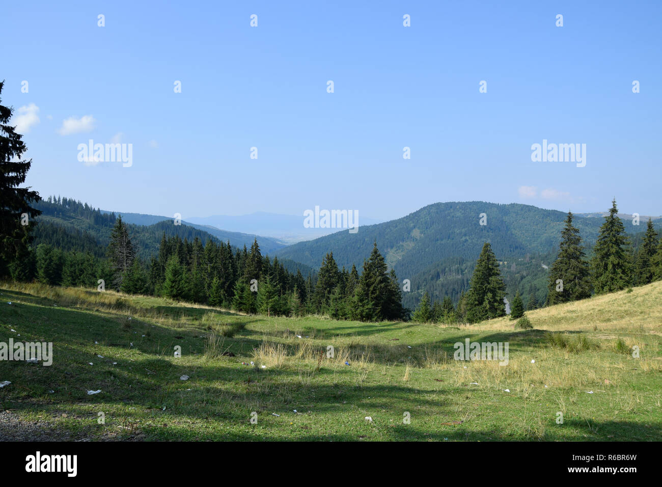 Carpathians mountains in Romania. 12C road near Bicaz Canyon. Mountain meadow with lots of garbage. Transylvania, Romania Stock Photo