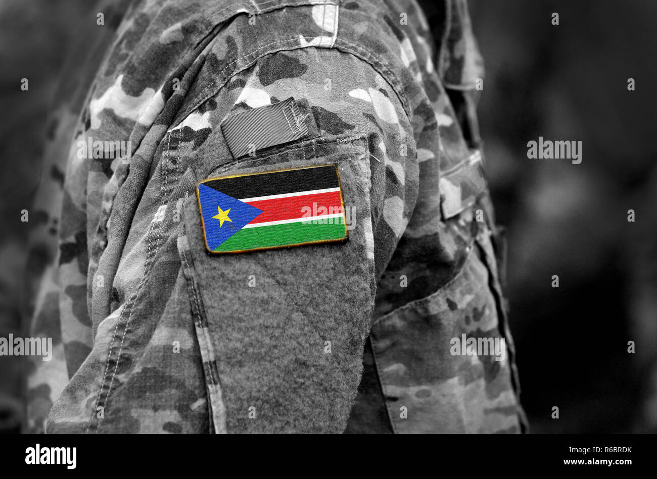 Flag of South Sudan on soldiers arm. South Sudan flag on military uniform. Army, troops, Africa (collage). Stock Photo