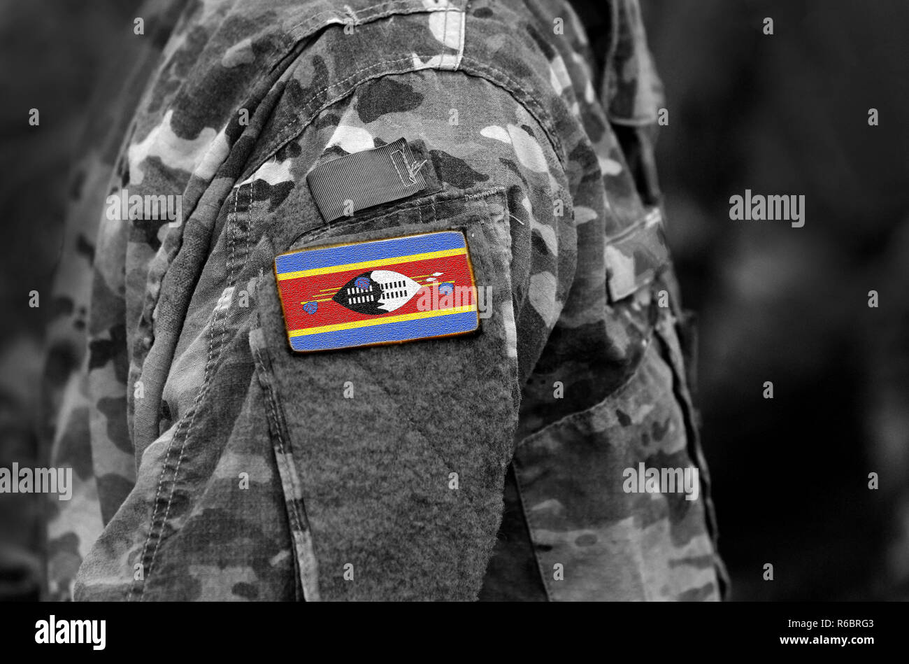 Eswatini, also known as Swaziland flag on soldiers arm. Kingdom of Eswatini flag on military uniform. Army, troops, military, Africa (collage). Stock Photo