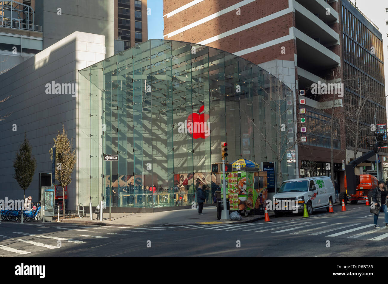 The Apple store in the Upper West Side neighborhood in New York displays its illuminated logo in (RED) marking World AIDS Day on Saturday, December 1, 2018. Apple will donate $1 for every transaction made with Apple Pay company wide to the Global Fund. 400 Apple stores have decorated their logo in (RED). (Â© Richard B. Levine) Stock Photo