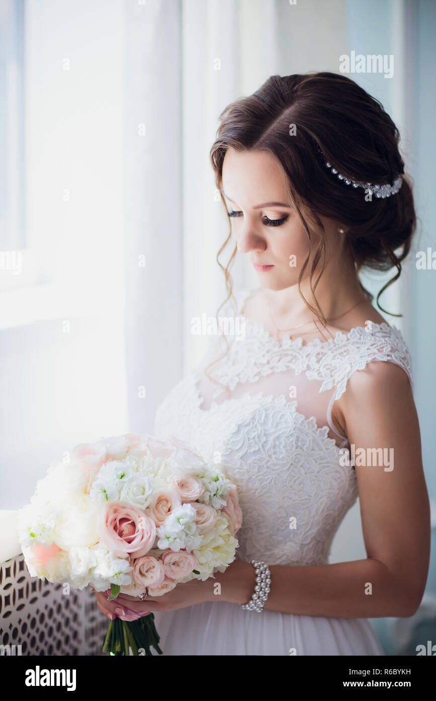 bride hold wedding bouquet of rose peonies and roses Stock Photo - Alamy