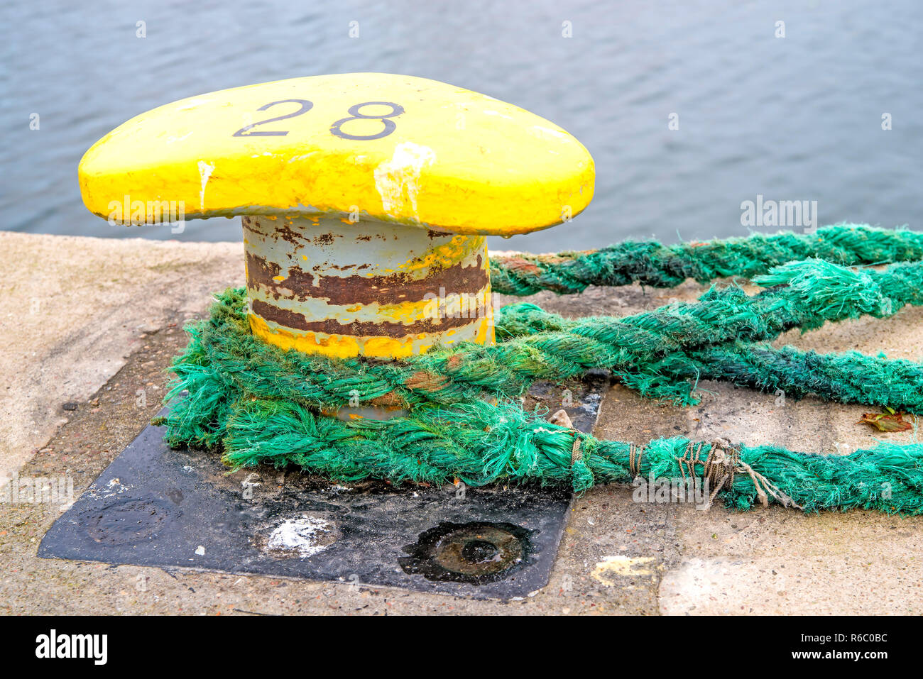 Bollard With Mooring Lines Stock Photo Alamy