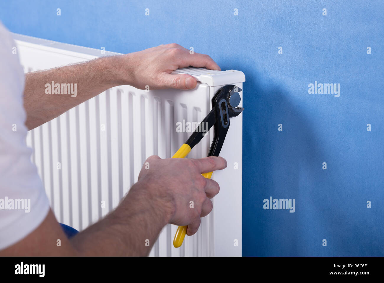 Human Hand Installing Radiator Stock Photo - Alamy