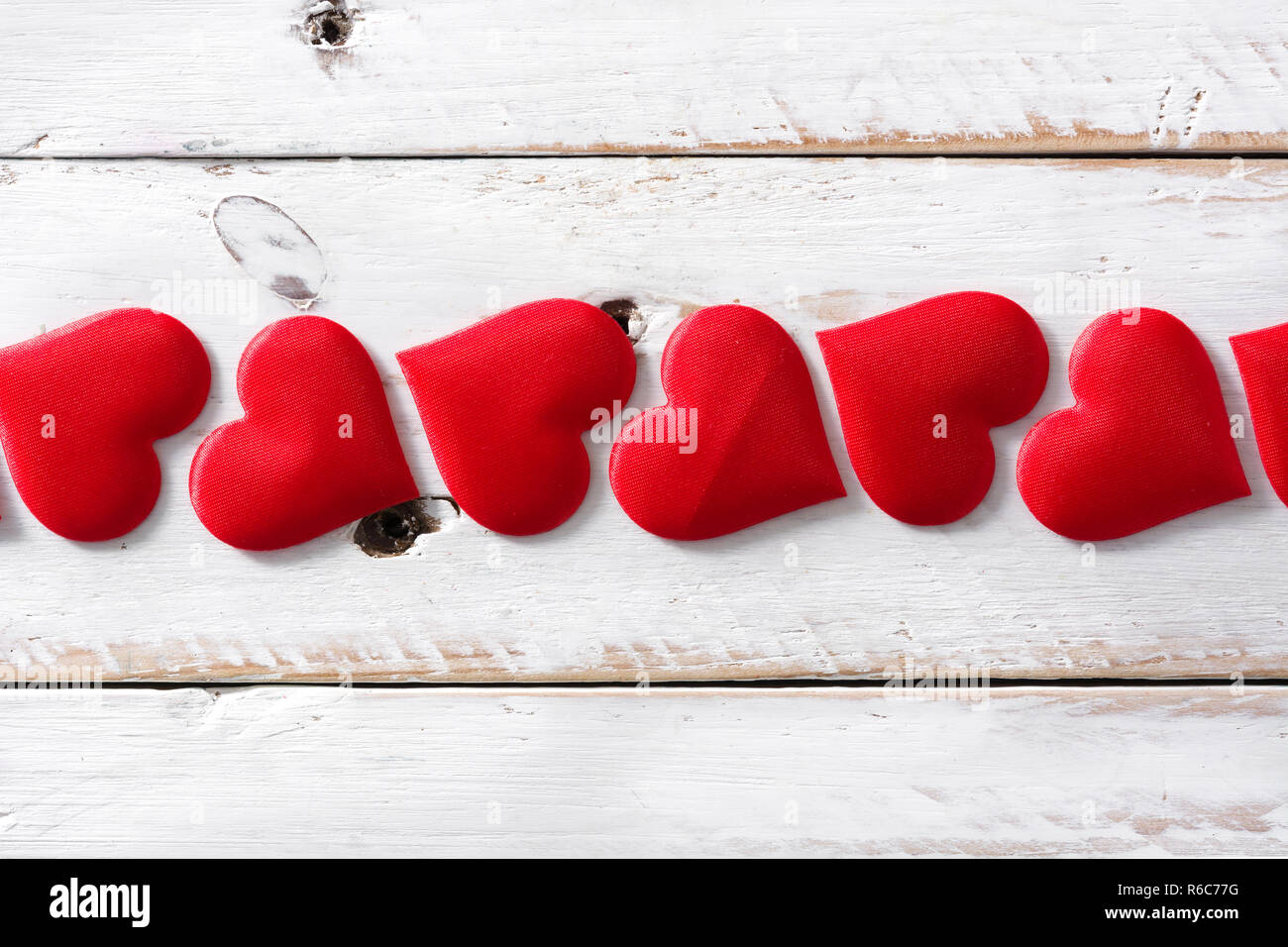 Red hearts pattern on white background. Top view. Stock Photo