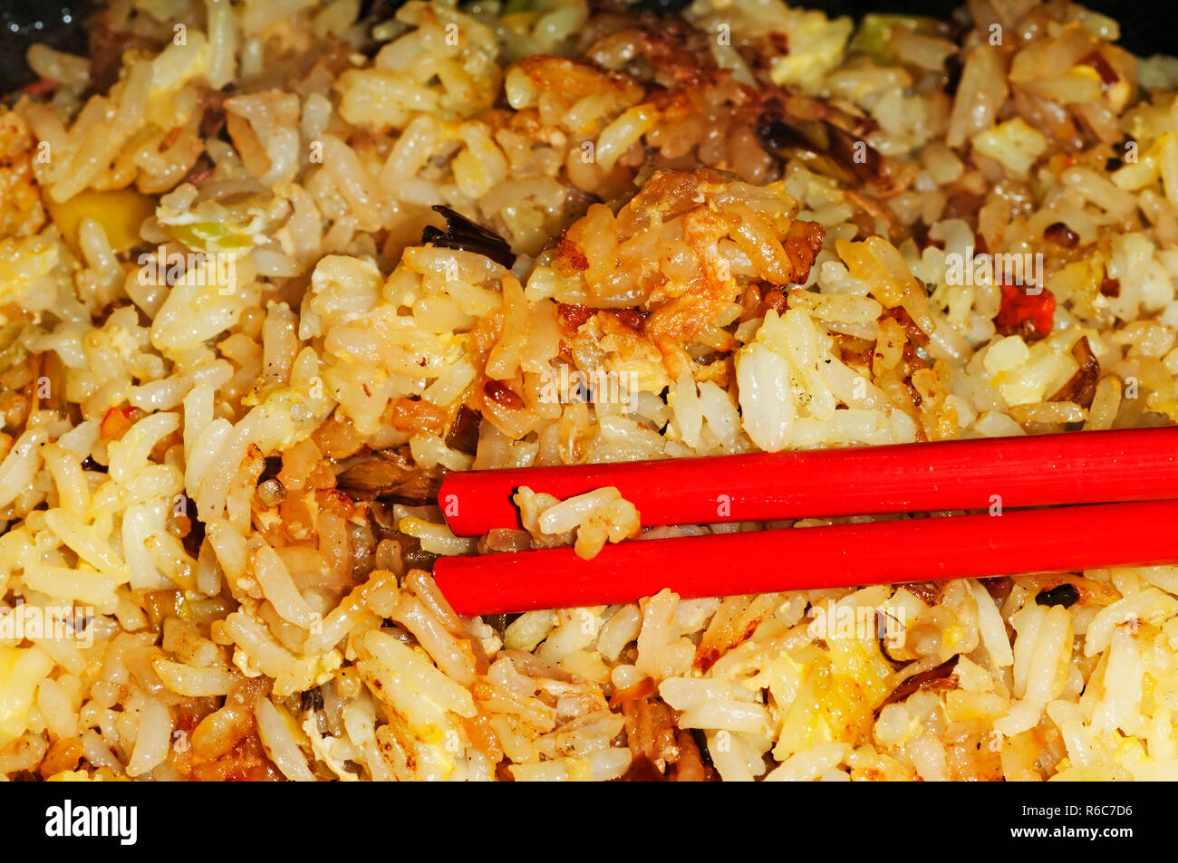 Baked Rice With Chopsticks Stock Photo Alamy