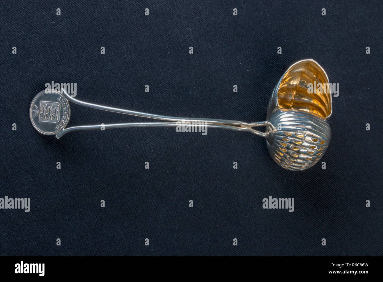 silver snail shaped spoon, gold lining, hallmark. Stock Photo
