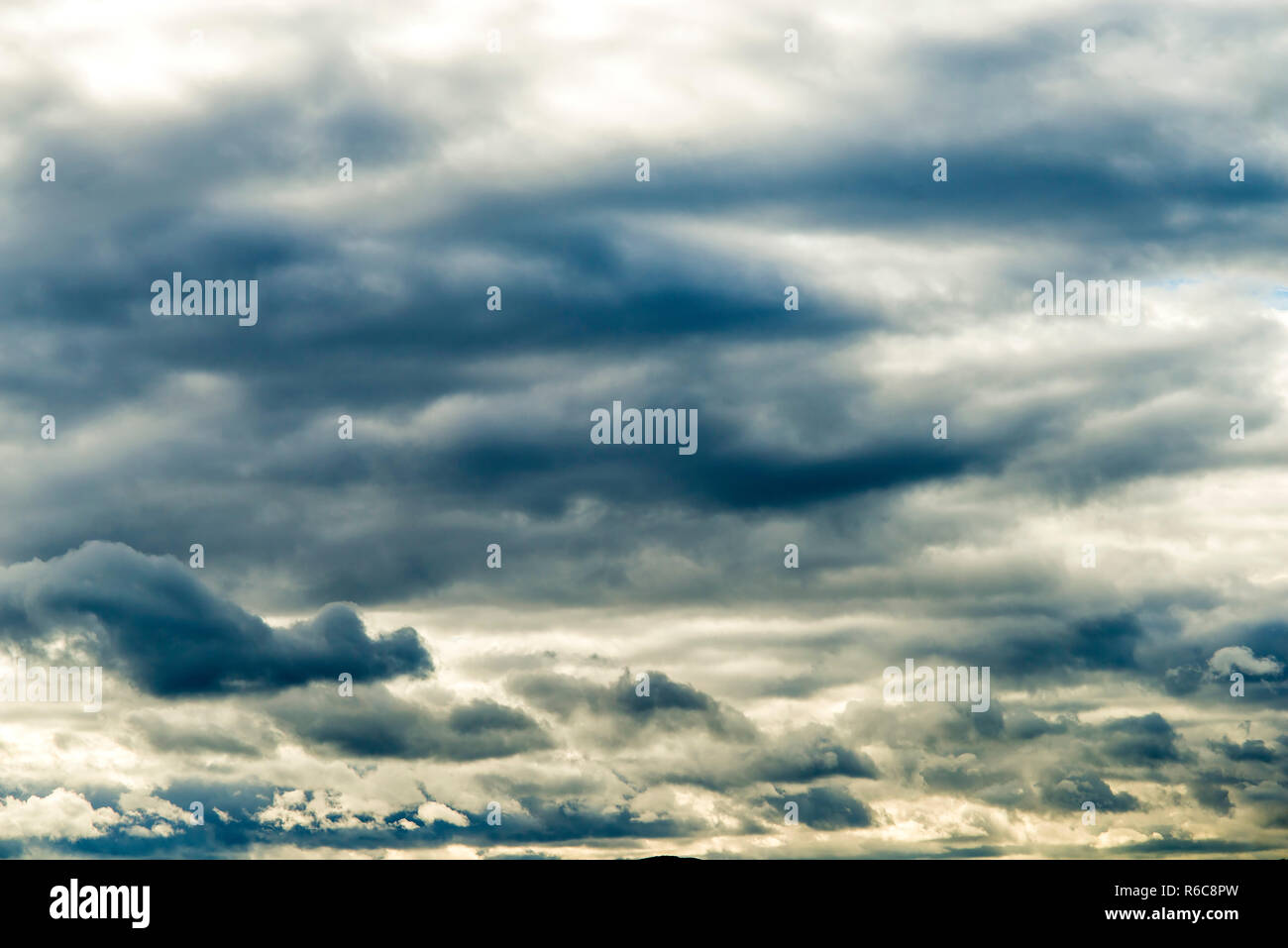 Blue Sky With Layers Of Clouds Stock Photo - Alamy