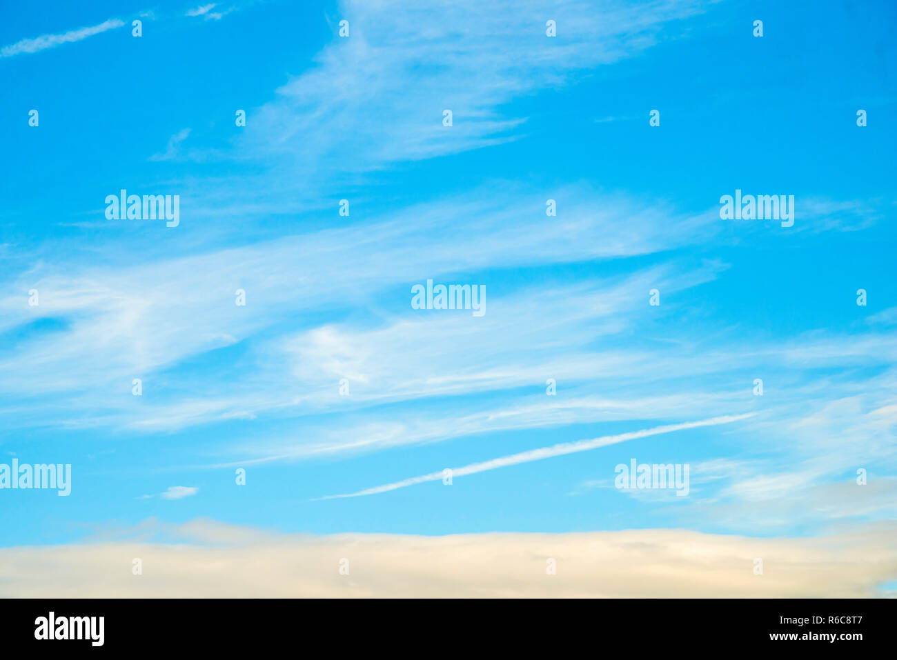 Blue Sky With Layers Of Clouds Stock Photo - Alamy