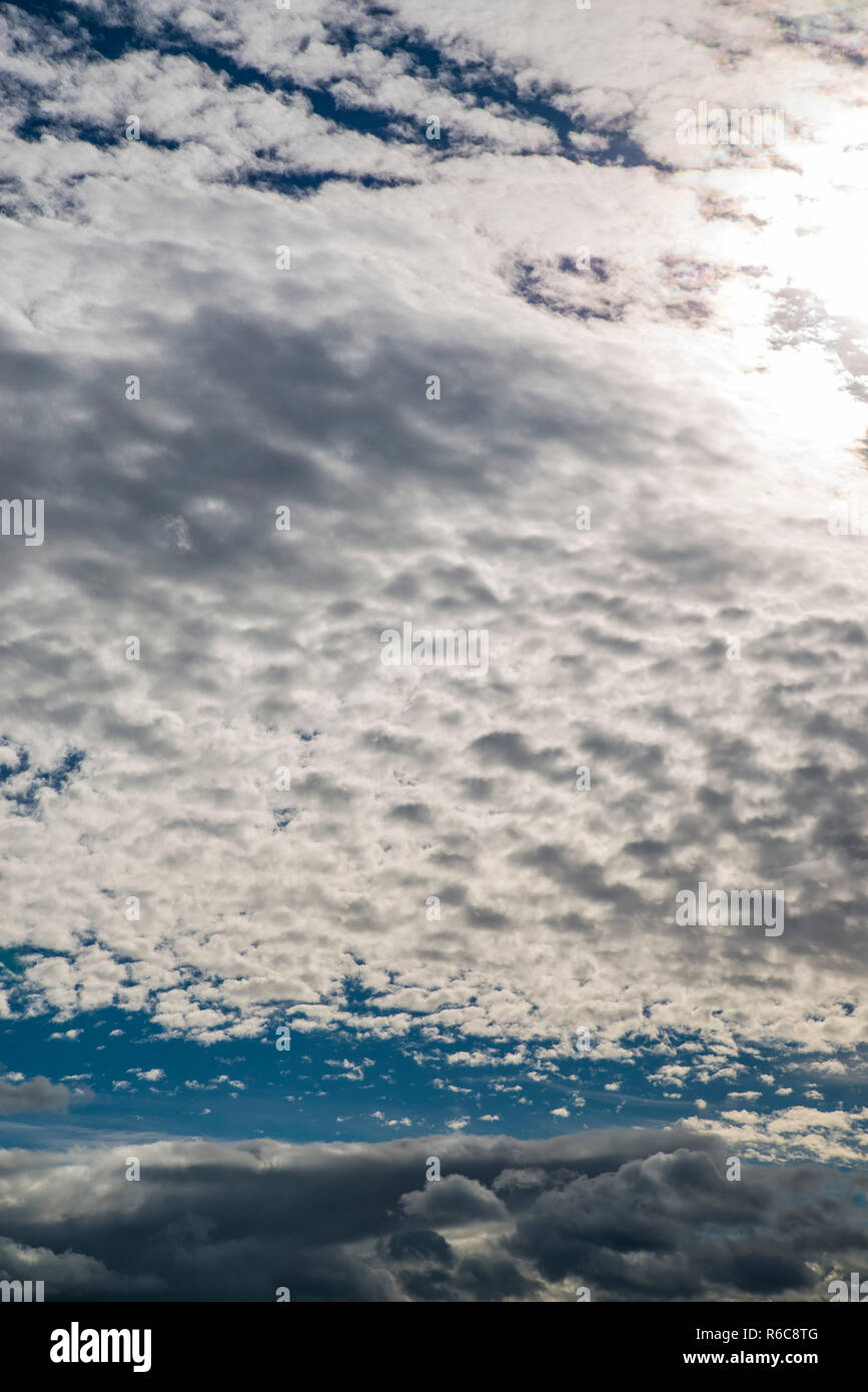 Blue Sky With Layers Of Clouds Stock Photo - Alamy