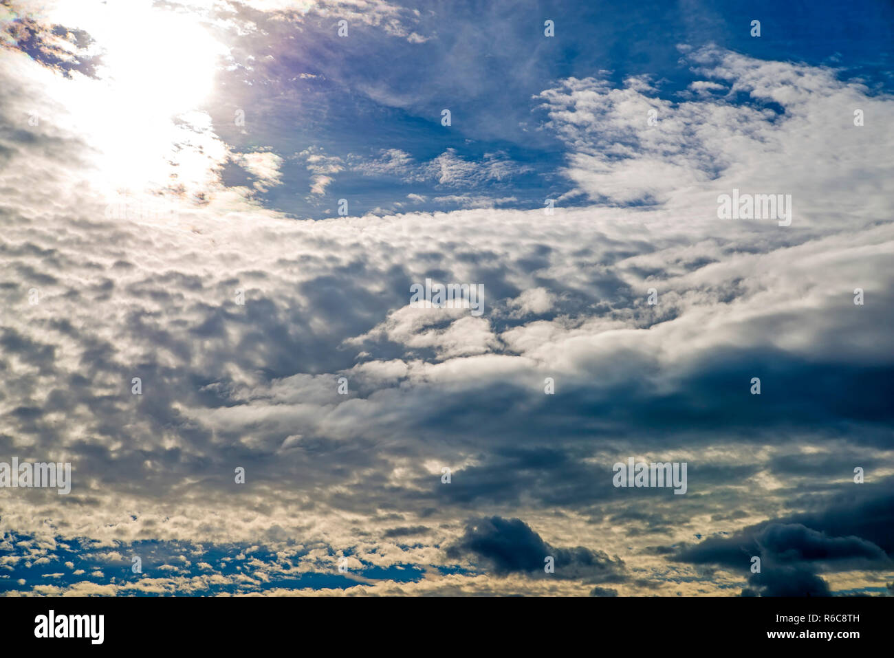 Blue Sky With Layers Of Clouds Stock Photo - Alamy