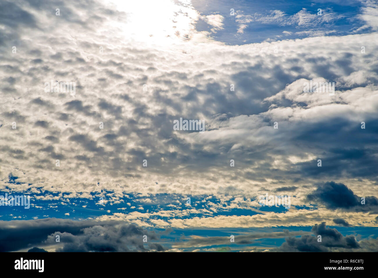 Blue Sky With Layers Of Clouds Stock Photo - Alamy