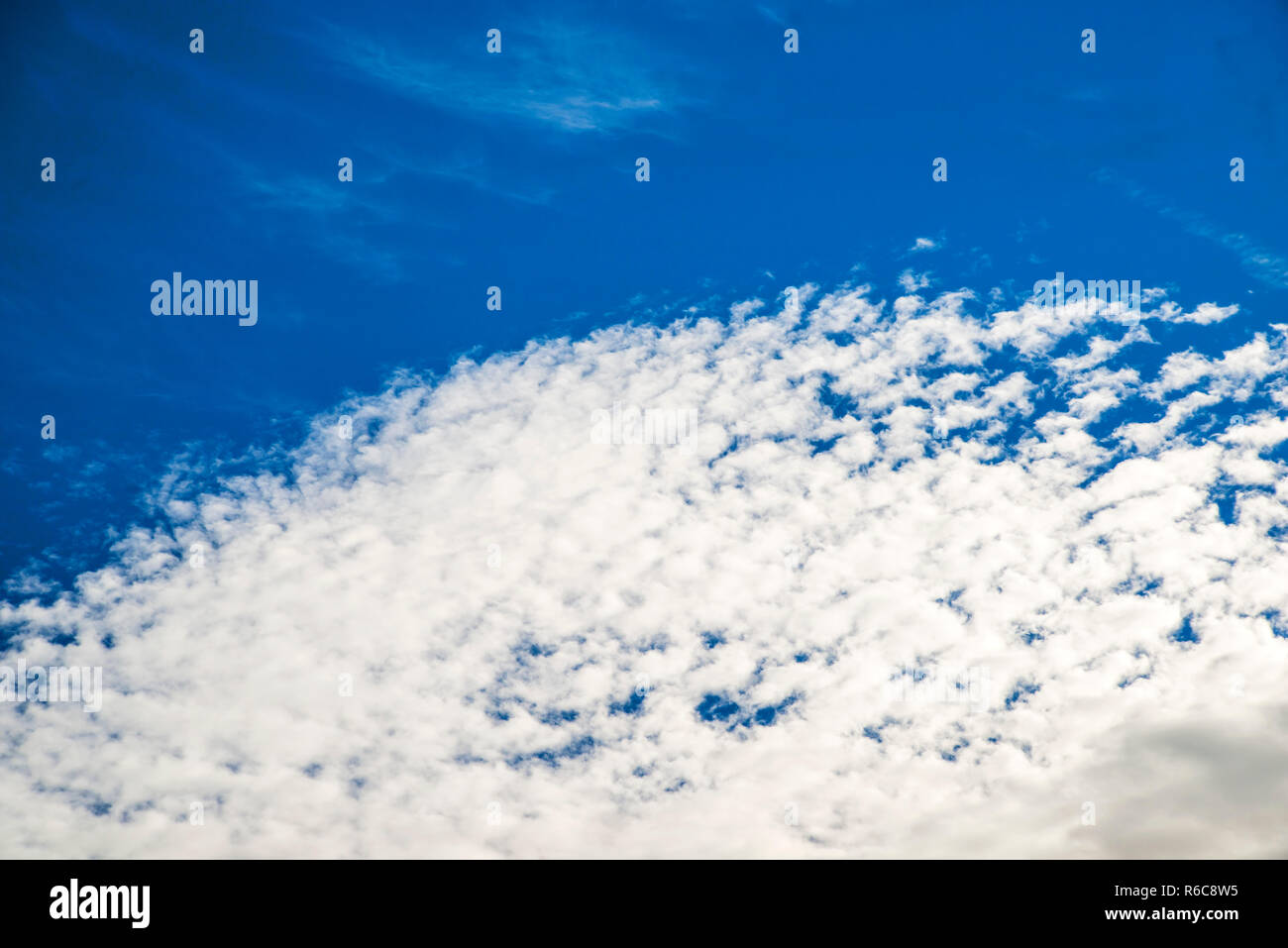 Blue Sky With Layers Of Clouds Stock Photo - Alamy