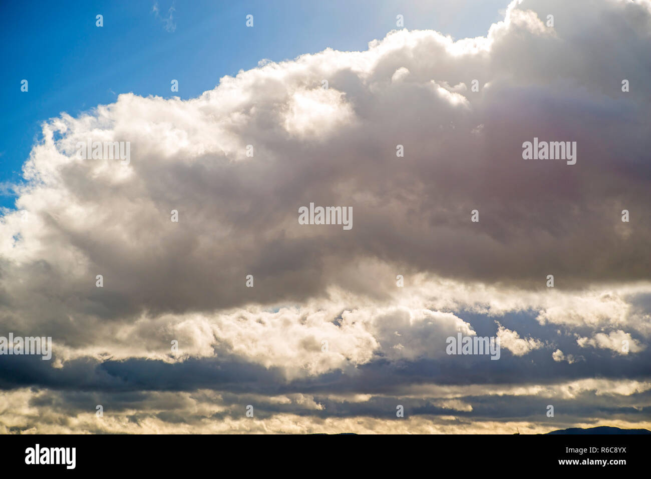 Blue Sky With Layers Of Clouds Stock Photo - Alamy