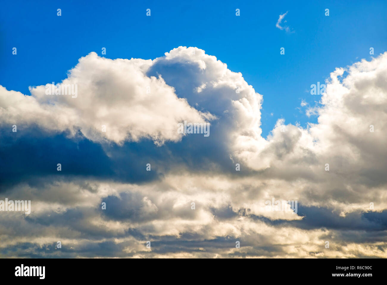 Blue Sky With Layers Of Clouds Stock Photo - Alamy