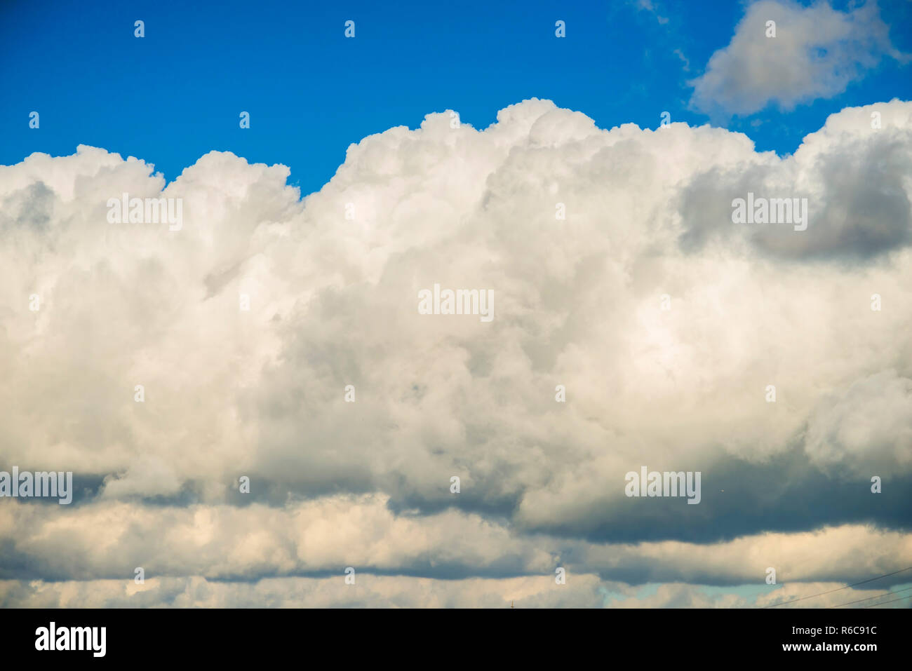Blue Sky With Layers Of Clouds Stock Photo - Alamy