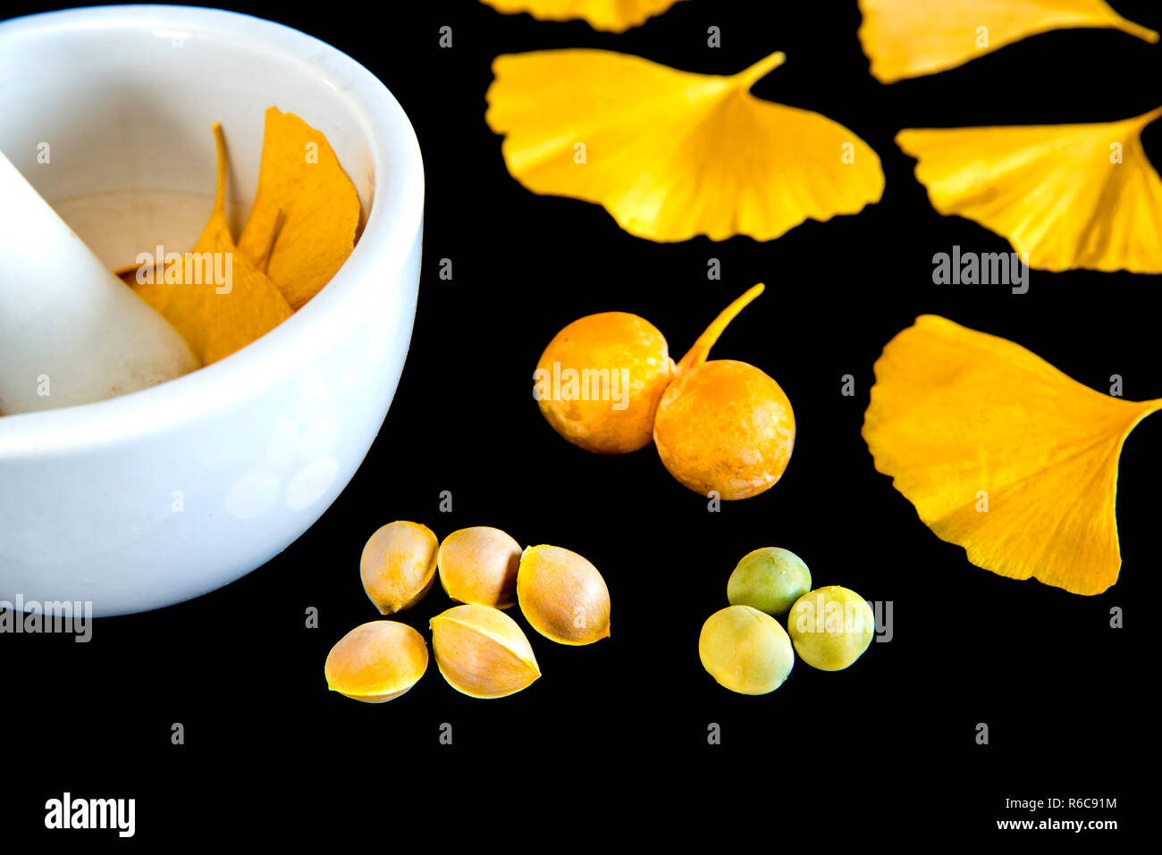 Ginkgo Leaves And Fruits With Mortar Stock Photo