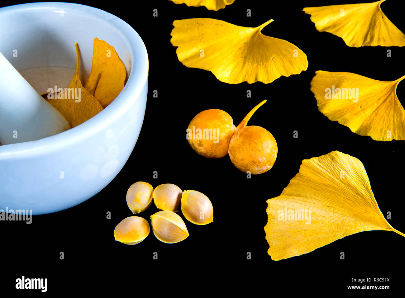 Ginkgo Leaves And Fruits With Mortar Stock Photo