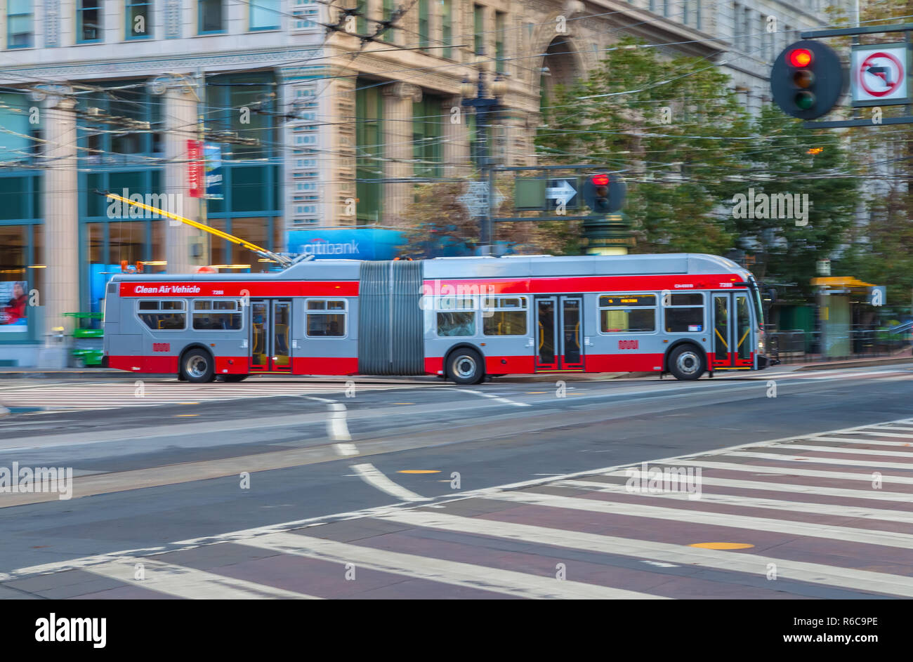 A trolley bus is running on the Market Street in San Francisco
