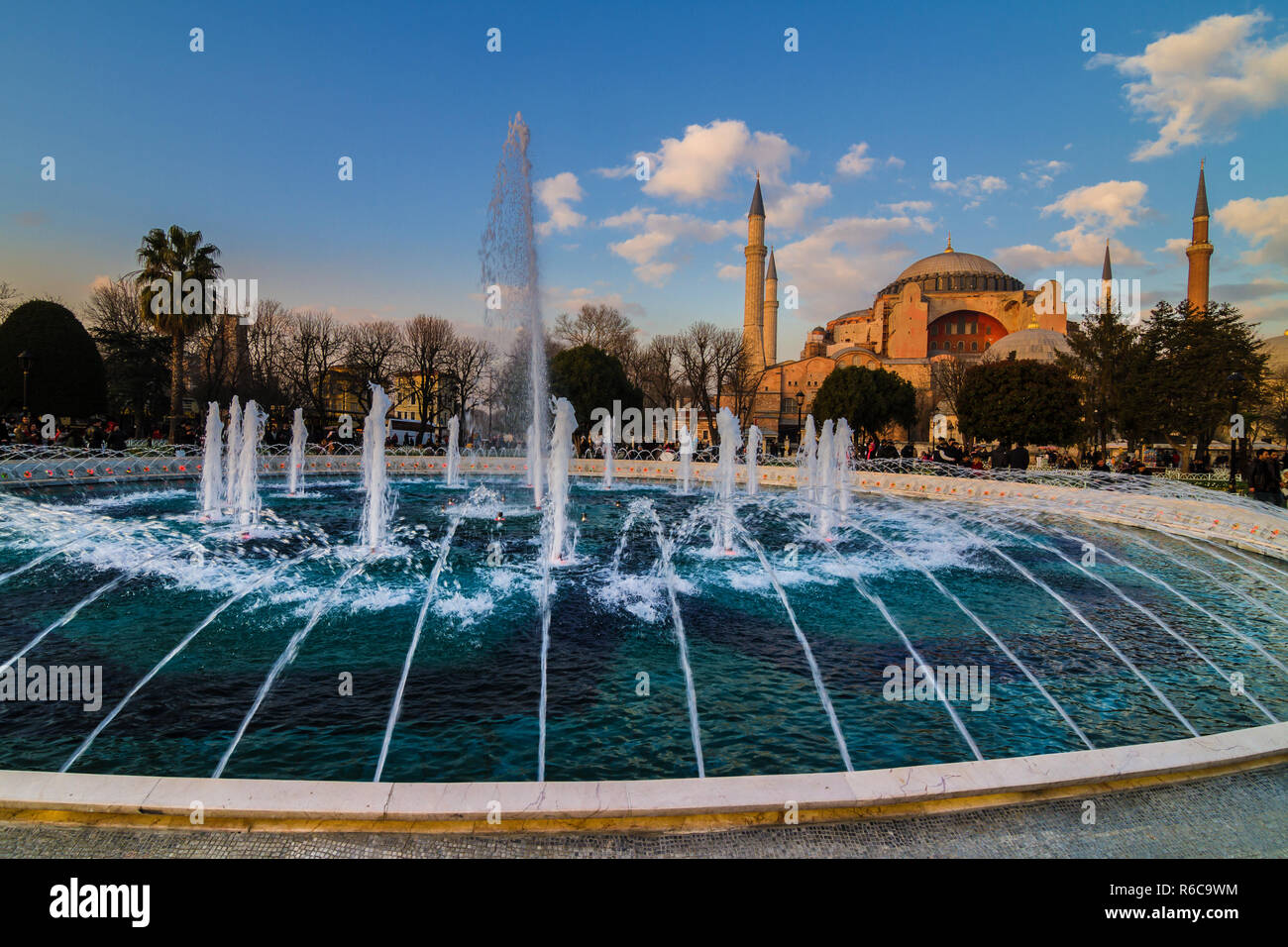 Hagia Sophia (Turkish: Aya Sofya) is a former Orthodox patriarchal church, later a mosque, and now a museum in Istanbul, Turkey. Fountains and blue po Stock Photo