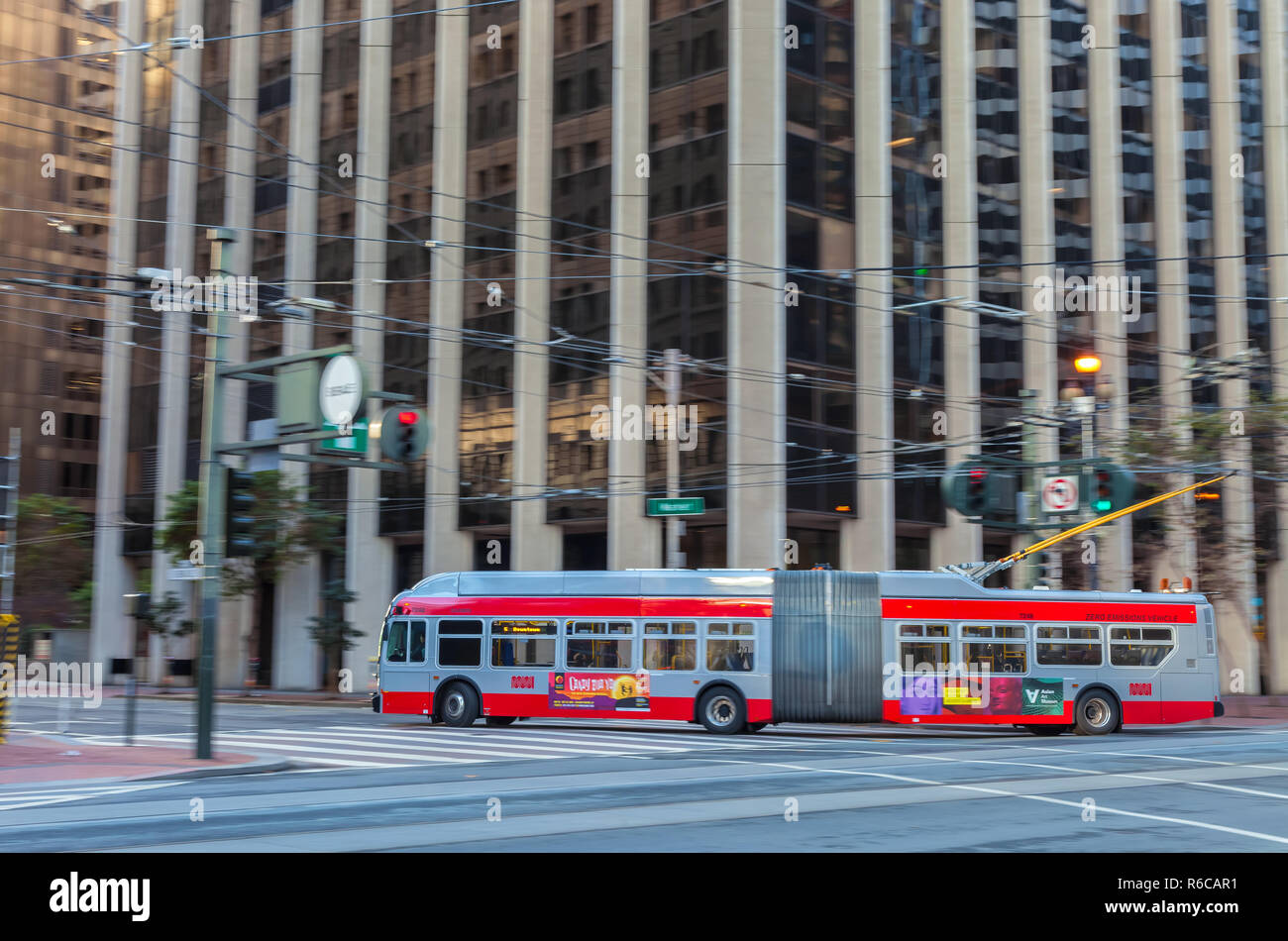 A trolley bus is running on the Market Street in San Francisco