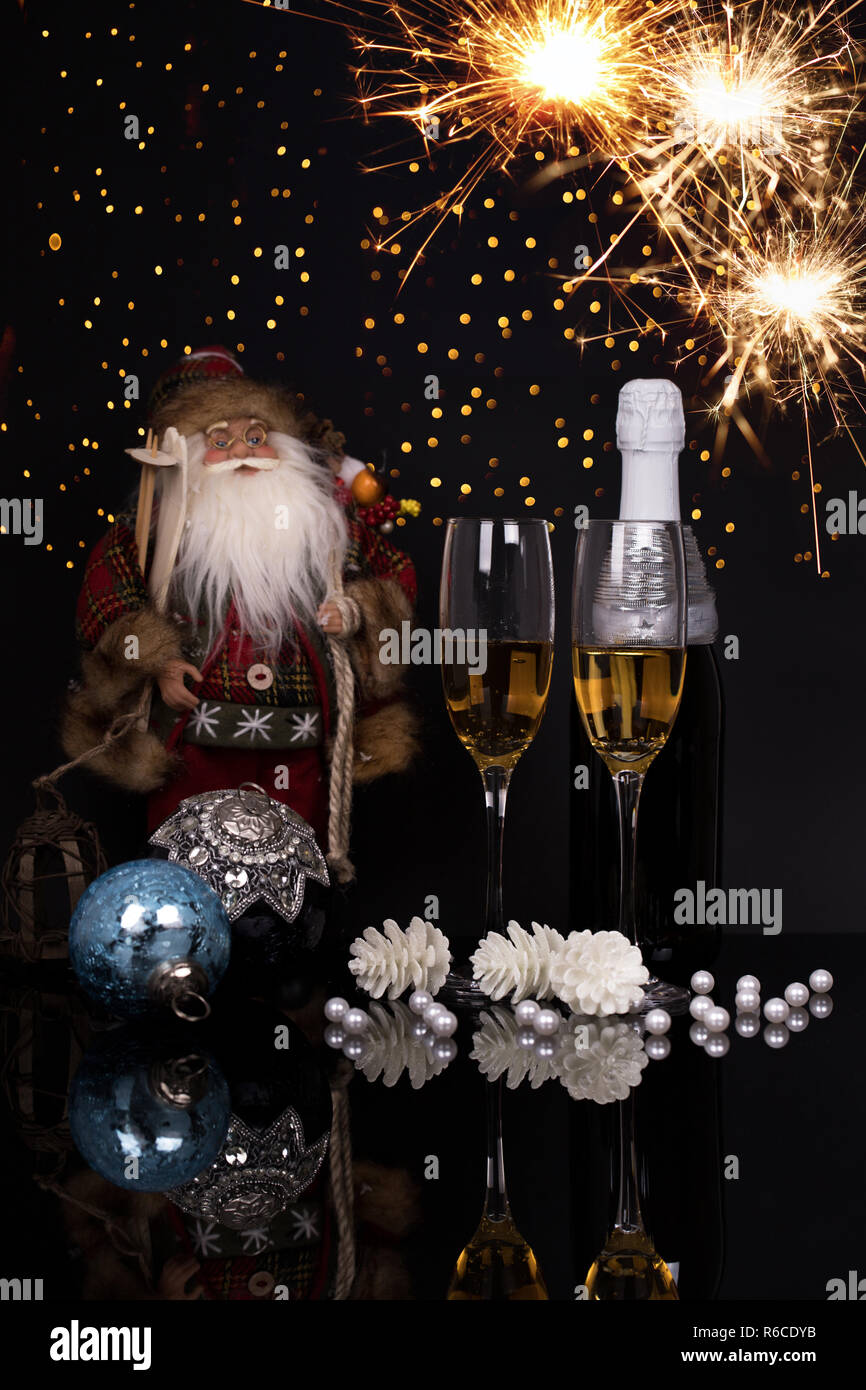 Two Wine Glasses With Champagne Santa Claus Sparklers And