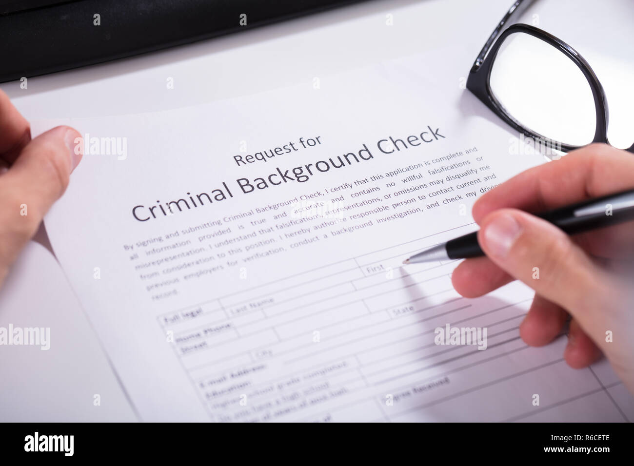 Person Hand Filling Criminal Background Check Application Form Stock ...