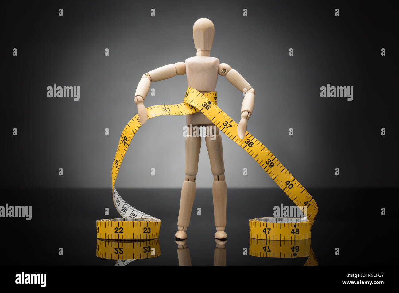 Wooden Dummy Measuring Waist With Measure Tape Stock Photo Alamy