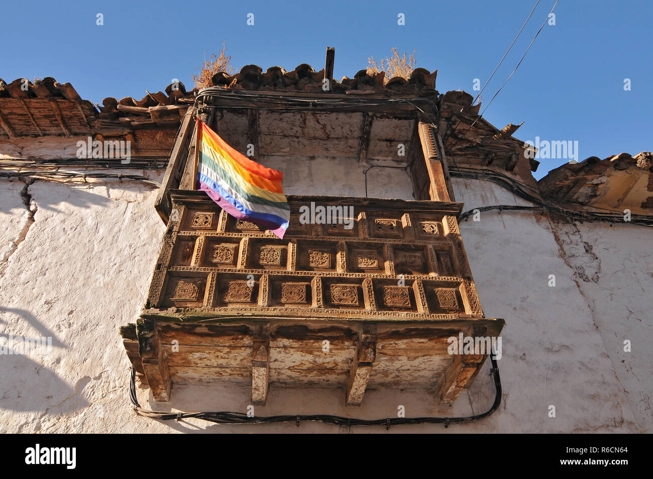 Peru, Cusco, Colonial Style Old Balcony With Cusco Flag Stock Photo