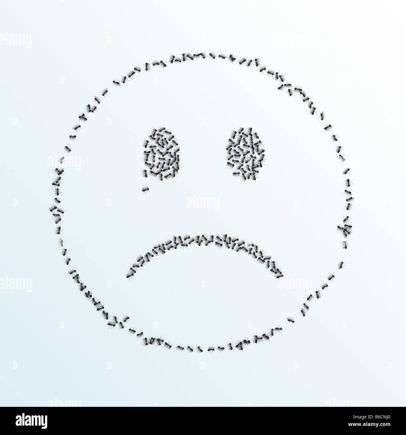 Cartoon unhappy face made from outline of ants on a white background Stock Photo