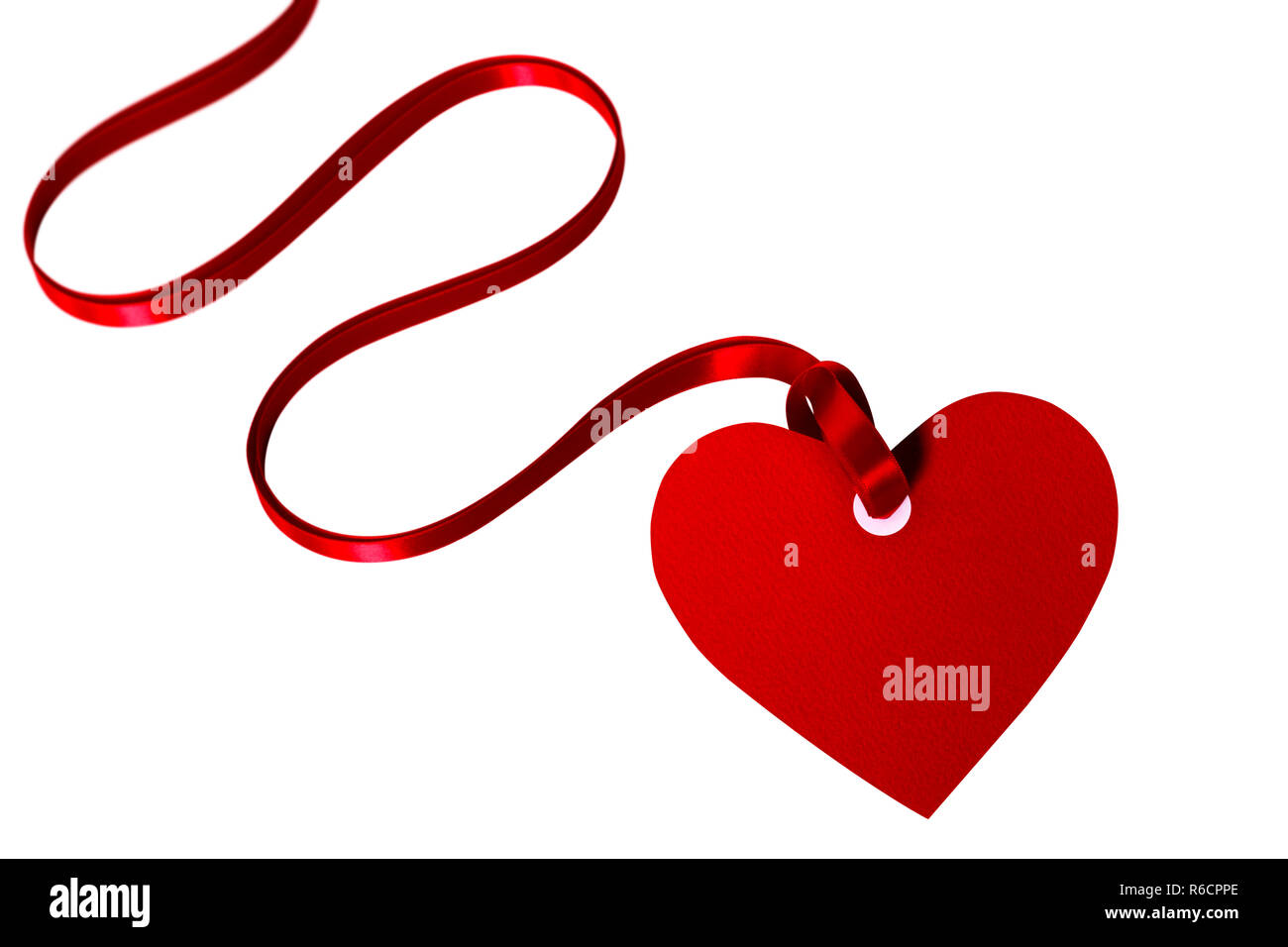 Valentine card or heart shaped gift tag with red ribbon isolated on a ...