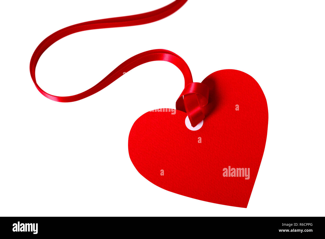 Valentine card or heart shaped gift tag with red ribbon isolated on a ...
